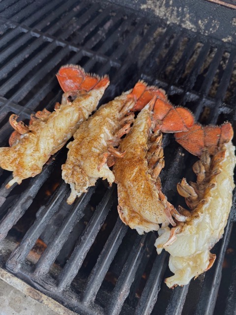 Four seasoned lobster tails on the grill at Rocklobster Fest, Josabi's, Helotes, Texas